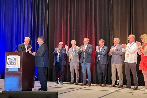 Frank Donahue (R) receives the CTDA Ring of Honor from Ceramic Tile Distributors Association executive director Rick Church