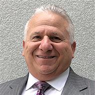 Lew Migliore Discusses Reg Burnett's Legacy in the Carpet Industry