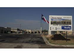 Texas Flooring Retailer Erects 100' Pole to Fly State Flag 