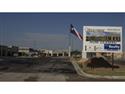 Texas Flooring Retailer Erects 100' Pole to Fly State Flag 
